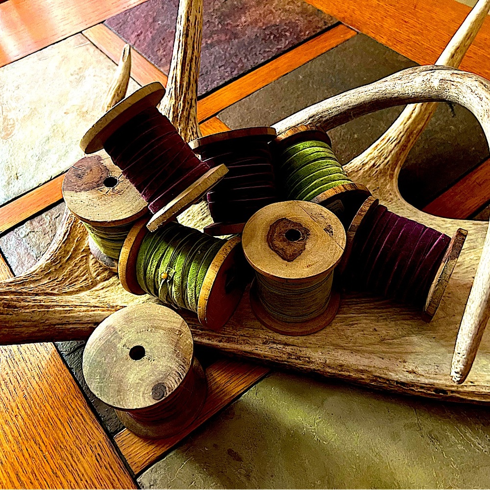8 beautiful wooden spools of ribbon. Some lengths unknown.
